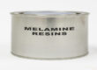 A metal container labeled "Melamine Resins" in black letters. The container sits against a plain white background.