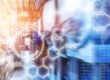 An abstract industrial scene with blurred machinery, molecular diagrams, and data overlays representing chemical process control.